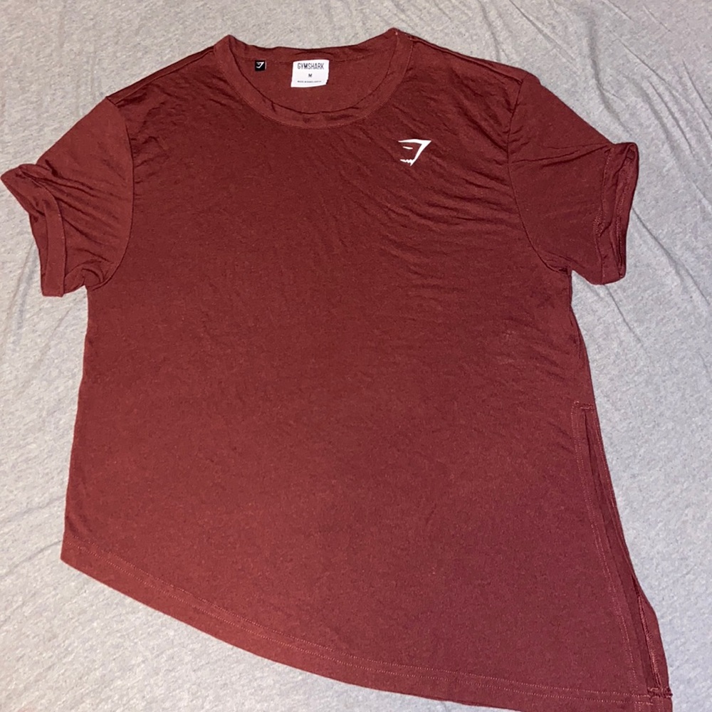 Woman’s Gymshark asymmetrical hem maroon athletic tee